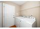 Convenient laundry room features a washer, dryer, and direct access to outside at 406 Homestead Park Dr. Dr, Apex, NC 27502