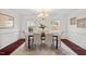 Elegant dining room with decorative rug, neutral walls and hardwood flooring at 409 Hanson Rd, Durham, NC 27713