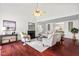 Elegant living room boasts high ceilings, fireplace, stylish furnishings, and an open layout for modern living at 409 Hanson Rd, Durham, NC 27713