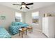 Bright and airy bedroom with twin beds, neutral decor, and ample natural light at 420 Retreat Ln, Wake Forest, NC 27587