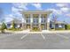 Attractive clubhouse exterior with stone accents, manicured landscaping, and convenient parking at 420 Retreat Ln, Wake Forest, NC 27587