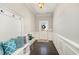 Welcoming foyer with dark wood floors, wainscoting, and coat rack offering a stylish and functional entry space at 420 Retreat Ln, Wake Forest, NC 27587