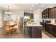 Well-equipped kitchen with stainless steel appliances, granite countertops, and a central island with seating, perfect for entertaining at 420 Retreat Ln, Wake Forest, NC 27587