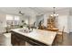 Open concept kitchen with granite countertops overlooking the living room and dining area at 420 Retreat Ln, Wake Forest, NC 27587