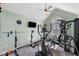 Home exercise room featuring weights, elliptical, and tv at 4225 Old Lewis Farm Rd, Raleigh, NC 27604