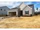 Gray home with a two-car garage, nice yard space, and an inviting entrance at 46 Rolling Banks Dr, Louisburg, NC 27549
