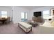 Open-concept living area with ample seating, modern décor, and a sliding door to the outdoor area at 46 Rolling Banks Dr, Louisburg, NC 27549