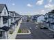 An aerial view of a well-planned townhome community showcasing ample parking and green spaces at 4810 Gossamer Ln # 105, Raleigh, NC 27616