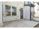 Backyard with concrete patio, door to home and utility connections at 4810 Gossamer Ln # 105, Raleigh, NC 27616
