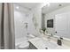 Stylish bathroom featuring tiled shower, quartz countertop vanity, and modern fixtures at 4810 Gossamer Ln # 105, Raleigh, NC 27616