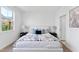 Inviting bedroom with modern decor, featuring a comfortable bed, side tables, and ample natural light at 4810 Gossamer Ln # 105, Raleigh, NC 27616