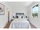 Inviting bedroom with modern decor, featuring a comfortable bed, side tables, and natural light at 4810 Gossamer Ln # 105, Raleigh, NC 27616
