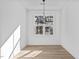 Modern dining room with hardwood floors and bright, natural light at 4810 Gossamer Ln # 105, Raleigh, NC 27616