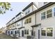 Row of townhomes showcasing white siding and well-maintained landscaping at 4810 Gossamer Ln # 105, Raleigh, NC 27616