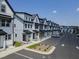 Townhome community featuring well-maintained landscaping, convenient parking, and appealing architectural design at 4810 Gossamer Ln # 105, Raleigh, NC 27616
