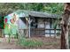 Charming outdoor nature center information hut with colorful mural promoting an educational garden at 4810 Gossamer Ln # 105, Raleigh, NC 27616