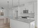 Bright kitchen boasts granite countertops and stainless steel appliances at 4810 Gossamer Ln # 105, Raleigh, NC 27616