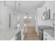 Open kitchen with granite island and stainless steel appliances, connecting to living area at 4810 Gossamer Ln # 105, Raleigh, NC 27616