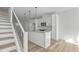Bright, modern kitchen featuring white cabinetry and a granite island at 4810 Gossamer Ln # 105, Raleigh, NC 27616