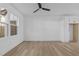 Bright living room featuring hardwood floors and a ceiling fan at 4810 Gossamer Ln # 105, Raleigh, NC 27616