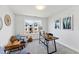 Bright office space with modern desk, chairs, and a large window offering neighborhood views at 4810 Gossamer Ln # 105, Raleigh, NC 27616
