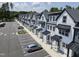 Modern townhomes with black awning accents and designated parking spots at 4810 Gossamer Ln # 105, Raleigh, NC 27616