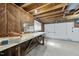 Basement with concrete floor, exposed ceiling and a work bench at 4905 Will-O-Dean Rd, Raleigh, NC 27616