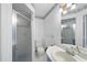 Bathroom showcasing a glass shower and a toilet in a tiled setting at 4905 Will-O-Dean Rd, Raleigh, NC 27616