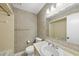 Bathroom featuring a single sink, toilet, vanity, and wallpaper at 4905 Will-O-Dean Rd, Raleigh, NC 27616