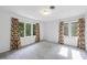 Bright bedroom with three large windows and patterned curtains offering plenty of natural light at 4905 Will-O-Dean Rd, Raleigh, NC 27616