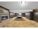 Spacious game room with a pool table, carpeted floors, brick fireplace and paneled walls at 4905 Will-O-Dean Rd, Raleigh, NC 27616