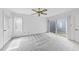 Bright, spacious main bedroom featuring a ceiling fan, carpeted floors and sliding doors to a private patio at 4905 Will-O-Dean Rd, Raleigh, NC 27616