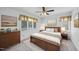 Tranquil primary bedroom featuring a comfortable bed, natural light, and elegant decor for a peaceful retreat at 4905 Will-O-Dean Rd, Raleigh, NC 27616