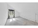 A bright room with neutral carpet and walls, decorated with dark-floral curtains, with ample natural light at 4905 Will-O-Dean Rd, Raleigh, NC 27616