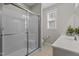 Well-lit bathroom with glass enclosed shower and single sink vanity at 5012 Trembath Ln, Cary, NC 27519