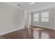 Spacious bedroom with hardwood floors, white trim, and natural light at 5012 Trembath Ln, Cary, NC 27519