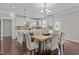 Well-appointed kitchen with center island, stainless steel appliances, and dining area at 5012 Trembath Ln, Cary, NC 27519