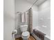 Cozy bathroom featuring a shower with curtain and a toilet with a towel rack at 5507 Eagles Nest Trl, Snow Camp, NC 27349