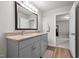 Bathroom with granite countertops, double sinks and wood-style flooring at 5507 Eagles Nest Trl, Snow Camp, NC 27349