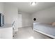 Bright bedroom featuring a bed, desk and natural light from the round window at 5507 Eagles Nest Trl, Snow Camp, NC 27349