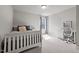 Bright bedroom featuring a bed, desk and natural light from the large window at 5507 Eagles Nest Trl, Snow Camp, NC 27349