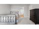 Comfortable bedroom featuring a black dresser and doorway to the bathroom at 5507 Eagles Nest Trl, Snow Camp, NC 27349