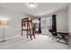 Bright bedroom with a unique loft bed, complemented by a study area near the large windows at 5507 Eagles Nest Trl, Snow Camp, NC 27349