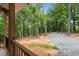 View from the porch of the long driveway lined with trees and gravel at 5507 Eagles Nest Trl, Snow Camp, NC 27349