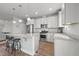 Bright kitchen features white cabinets, stainless steel appliances, granite countertops, and a large island at 5507 Eagles Nest Trl, Snow Camp, NC 27349