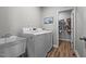 Well-organized laundry room featuring appliances, storage, and utility sink at 5507 Eagles Nest Trl, Snow Camp, NC 27349