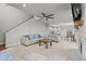 Bright living room with a ceiling fan, neutral tones, and a staircase leading to the upper level at 5507 Eagles Nest Trl, Snow Camp, NC 27349