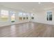 Light filled living room with a door to the backyard and lovely hardwood floors at 553 Winding Creek Dr, Lillington, NC 27546