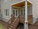 Enjoy your morning coffee on this back porch with stairs to the backyard at 5714 Belmont Valley Ct, Raleigh, NC 27612