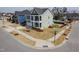 Corner lot featuring a two-story home with a black-fenced backyard, a pool, and lush landscaping at 601 Copper Beech Ln, Wake Forest, NC 27587